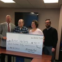 <p>From left, Shelton Mayor Mark Lauretti, recipient Burton Wellons, daughter Robin Friend and Mike Gill of Economy Fuel hold Wellons&#x27; check.</p>