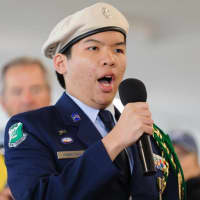 <p>James Hobayan of Norwalk High School sings the “Star-Spangled Banner” at the race.</p>