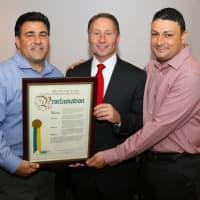 <p>Westchester County Executive, Rob Astorino presents a proclamation declaring Thursday &quot;T&amp;J Day&quot; to John Ruggiero and Ray Sassano, co-owners of T&amp;J Restaurant and Pizzeria, which reopened at a new, expanded location at 10 Pearl St. in Port Chester.</p>