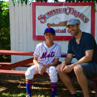 <p>Neil Walker poses with a camper at Summer Trails in Somers.</p>