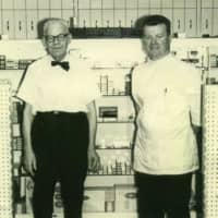 <p>Tom Collins Jr., right, with his dad, the late Tom Collins Sr., who opened the original Collins Pharmacy in 1931.</p>