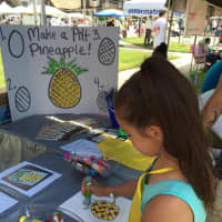 <p>Kids colored a &quot;Pitt Pineapple&quot; -- the firm&#x27;s logo -- at the brokerage&#x27;s booth at the 2016 Stratford Main Street Festival.</p>