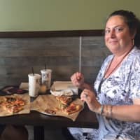 <p>Sloane and Larayne Peterson enjoy their pies at PizzaRev.</p>