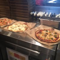 <p>Three pies from PizzaRev in Nanuet.</p>