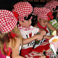 <p>Young patrons of Pizza One in Haskell take part in a make-your-own pizza party.</p>