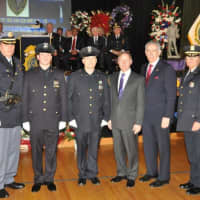 <p>Police Officers Stephen Betz and Adam Mietlowski of the Dobbs Ferry Police Department with county and police officials.</p>