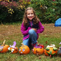 <p>Pumpkin painting is a continuing tradition at the Fall Festival.</p>