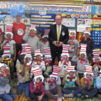 <p>Poughkeepsie Mayor Rob Rolison reading with students and volunteers at Astor Poughkeepsie during the 2016 event.</p>