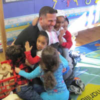 <p>Dutchess County Executive Marcus Molinaro reading to students at The Catharine Street Center during the 2016 event.</p>