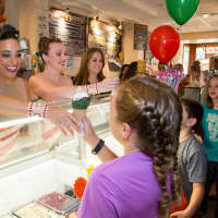 <p>The Rockettes serve ice cream to fans in Tarrytown.</p>