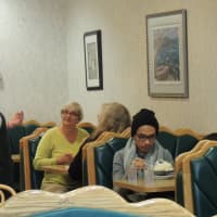 <p>A family orders in the old-fashioned, shiny clean lunch room.</p>