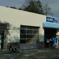 <p>Customers belly up to the take-out window at Ralph&#x27;s Italian Ices and Ice Cream in Mamaroneck to get cold treats on a hot summer day. Neighbors are complaining about the noise, traffic and trash the shop generates.</p>
