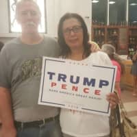 <p>John and Millie Pitzschler of Putnam show off their Trump-Pence sign after the rally at Sacred Heart University.</p>