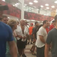 <p>The crowd rushes out after the Trump rally at Sacred Heart University after a fierce thunderstorm began.</p>