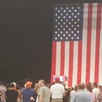 <p>The press and the public begin to file into the William H. Pitt Center at Sacred Heart University, where a giant U.S. flag is hanging for the Trump rally.</p>