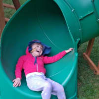<p>Now, Riley — whose brain surgeries have altered her mobility as well as the dexterity in her left-sided extremities — can enjoy the physical and emotional benefits of outdoor play in the comfort and safety of her own yard.</p>