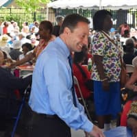 <p>Rob Astorino talks with some of the guests at the Westchester annual senior pool party/barbeque in White Plains.</p>