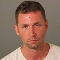 <p>Douglas Rollman, 26, of Mahopac, N.Y., is facing numerous charges in connection with a tussle with a security employee at a Macy&#x27;s in Danbury, according to police.</p>