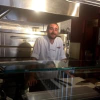 <p>Brian Rosenchein serves as pizza chef at Romanacci Pizza Bar Express.</p>