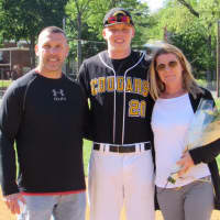 <p>Trevor Romeo with his dad, Jim, and mom, Kristen, on Senior Day</p>