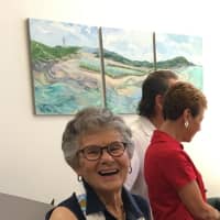 <p>Roshi Newman with one of her paintings to be displayed to the public June 2-3 during a unique pop-up art gallery at her son, Charles J. Newman&#x27;s Peekskill insurance office at 906 South St.</p>