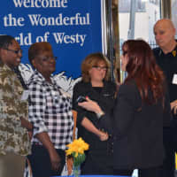 <p>Clients Sandra and Moriah (left) with Cynthia Massarksy (center) and Lyndhurst Police Chief James O&#x27;Connor (right)</p>