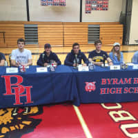 <p>Left to right: Byram Hills senior athletes Emma Fruhling, Matt Groll, Ally Steffen, Jack Beer, Steven Max, Sylvie Binder and David Noel. The students signed letters of intent for their colleges.</p>