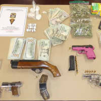 <p>Some of the drugs and guns seized during a search of a Bridgeport home.</p>