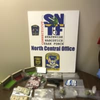 <p>The drugs, gun, and cash seized during warrant arrest.</p>