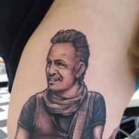 <p>Laura Krikorian of Lodi has a life-like depiction of Bruce Springsteen tattooed on her leg.</p>