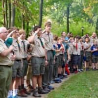 <p>Scouts and leaders salute at the recent Boy Scout Community Camporee in Tilley Pond Park. </p>