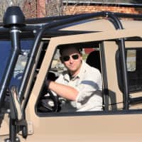<p>Mike Sandone in his Land Rover: He is a cave explorer described as “Monroe’s Indiana Jones.”</p>