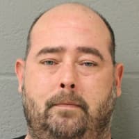 <p>Scott Young, 39, of Southington was charged with setting fire to his own liquor store in Newtown and scribbling racist graffiti to cover it up.</p>