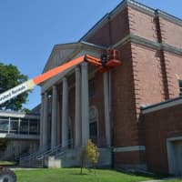 <p>Workers finished off a new roof this summer at Bassick High School. </p>