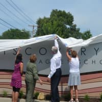 <p>Students at the Discovery Magnet School in Bridgeport will be greeted on the first day of school by this magnificent new sign, which was unveiled over the summer. </p>