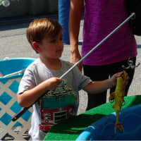 <p>Go Fish! Kids went fishing for prizes at the Lyndhurst Labor Day Street Fair </p>