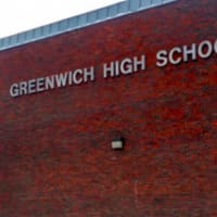 <p>Construction crews work to prepare the site of the old Greenwich High School auditorium Wednesday for construction of new classrooms. Pictured here is the old auditorium.</p>