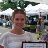 <p>Lori Cochran-Dougall, Executive Director of the Westport Farmers Market, accepts her DVlicious first-place award. </p>