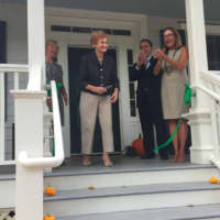 <p>Louise Mueller cuts the ribbon at the official opening of the Greenwich Land Trust&#x27;s new headquarters at the Louise Mueller Preserve.</p>