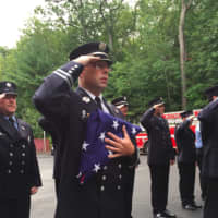 <p>Wilton Fire Department Capt. Kevin Czarnecki holds the flag that will be raised during Wilton&#x27;s 9/11 ceremony on Friday.</p>