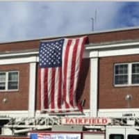 <p>An American flag is draped on the Fairfield Fire Department headquarters on Friday, Sept. 11. </p>