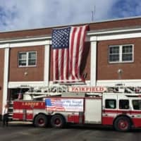 <p>An American flag is draped on the Fairfield Fire Department headquarters on Friday, Sept. 11. </p>