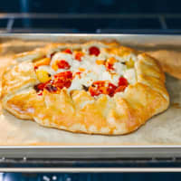 <p>Show off the summer’s beauty queen in all her sweet and tangy glory with this tomato tart.</p>