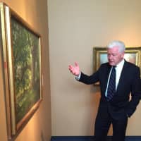 <p>Bruce Museum Executive Director Peter C. Sutton gives a tour of the works of American artist Charles Harold Davis. The exhibit is open to the public beginning Saturday and continues until Jan. 3.</p>