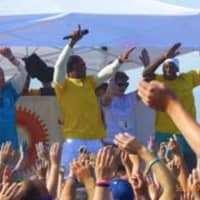 <p>First Selectman Jim Marpe in the blue shirt helps warm up the crowd at the Colorflash at Sherwood Island State Park in Westport. </p>