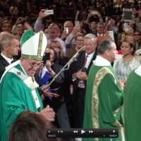 <p>Pope Francis proceeding toward the stage in Madison Square Garden. </p>