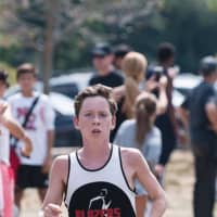 <p>Bart Codd of the New Canaan Blazers pulls away from the pack during a race earlier this year. </p>