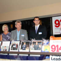 <p>From left, the A.G. Williams team of George Williams, Laine Rigano, Douglas Kitchen and Paul Viggiano listen to George Williams give his acceptance speech at the 914INC Small Business Awards ceremony.</p>