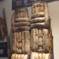 <p>Old goalie pads hang on the wall at the WESCO Sports Center.</p>