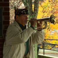 <p>Ron Dietman plays the Last Post during the Veterans Day ceremony in Shelton on Wednesday.</p>